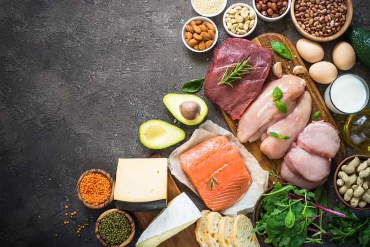 several high protein foods like chicken, salmon, eggs and avocado