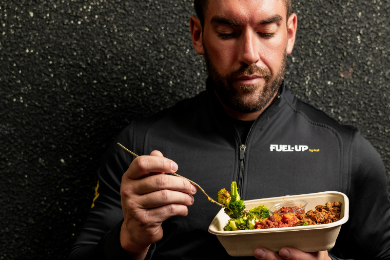 mean eating meal with dark background