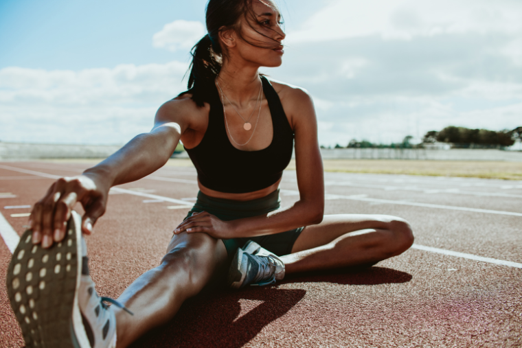 woman stretching outdoors in the day