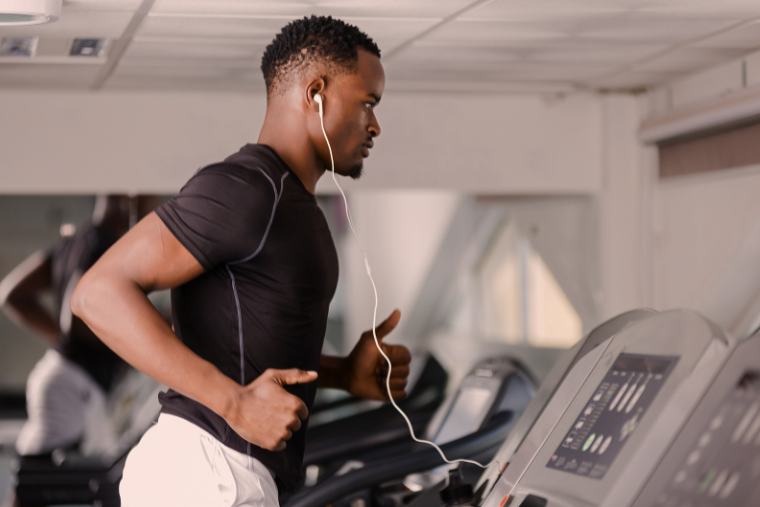 man running indoors on treadmill